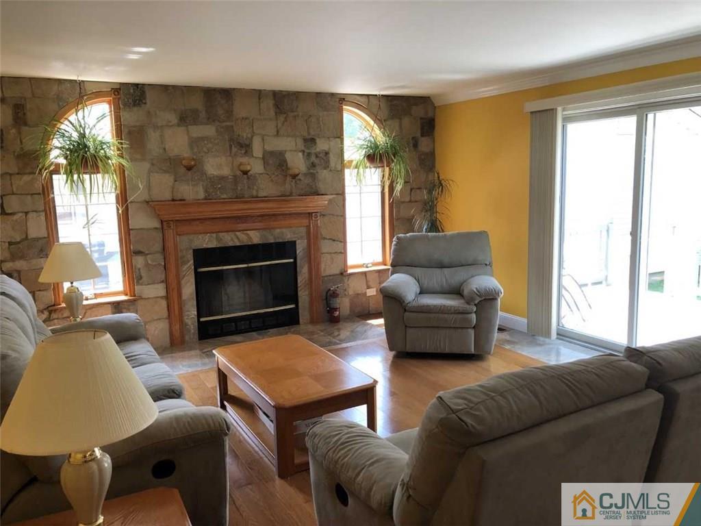 36 Ferris Road Edison, NJ 08817 - Photo 5 of 22 a living room with furniture and a fireplace