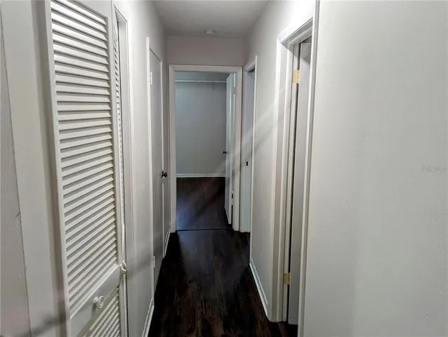 a view of a hallway with a closet