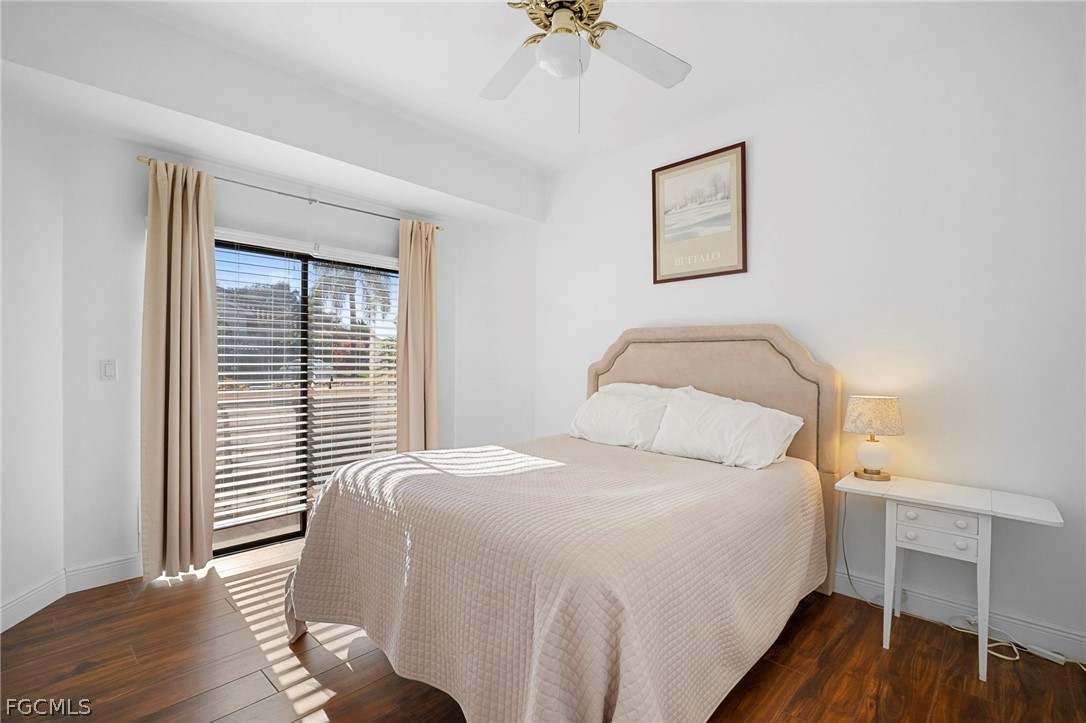 11772 Mahogany Run Fort Myers, FL 33913 - Photo 34 of 50 a bedroom with a bed and a chandelier