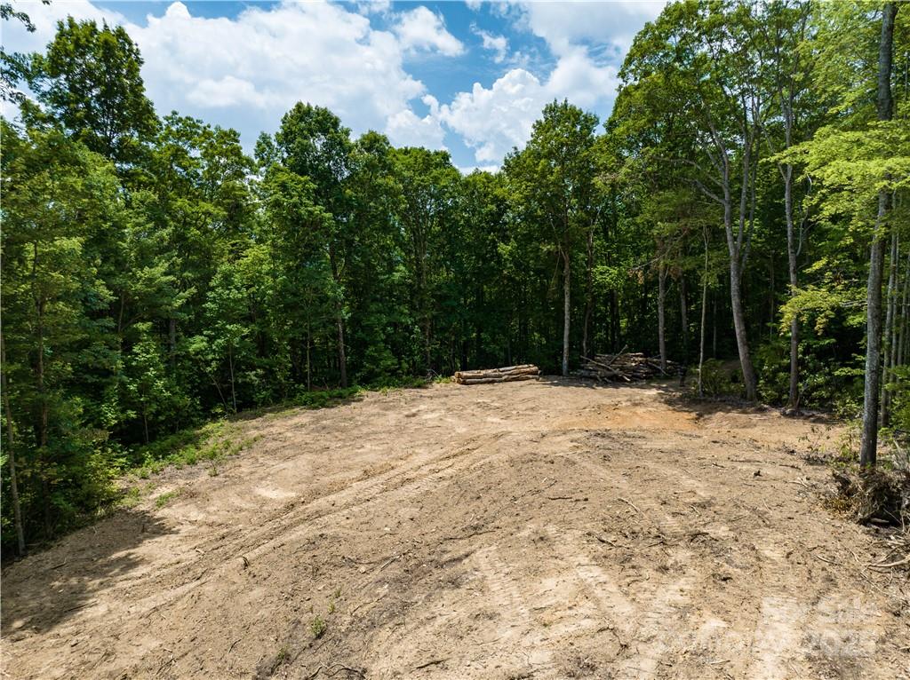 99999 Parris Branch Road, Unit 16 A B C Sylva, NC 28779 - Photo 11 of 12 a backyard of a house with lots of green space