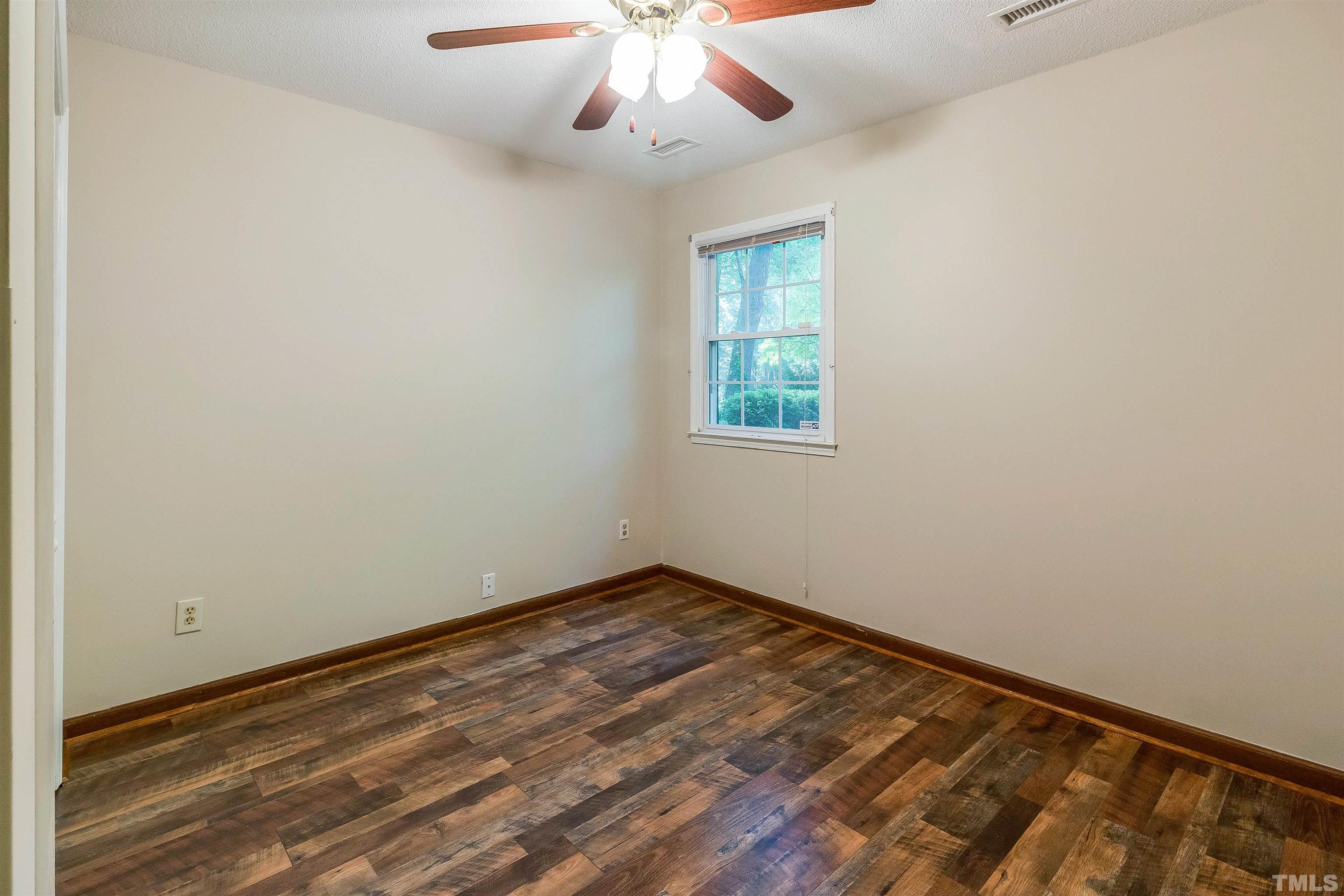 4350 Pickwick Drive Raleigh, NC 27613 - Photo 17 of 27 an empty room with a window