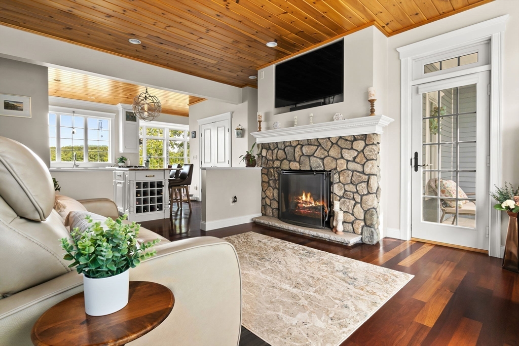 24 Old Rowley Road Newbury, MA 01951 - Photo 11 of 42 a living room with furniture fireplace and flat screen tv