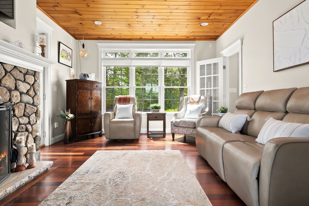 24 Old Rowley Road Newbury, MA 01951 - Photo 12 of 42 a living room with furniture and a flat screen tv