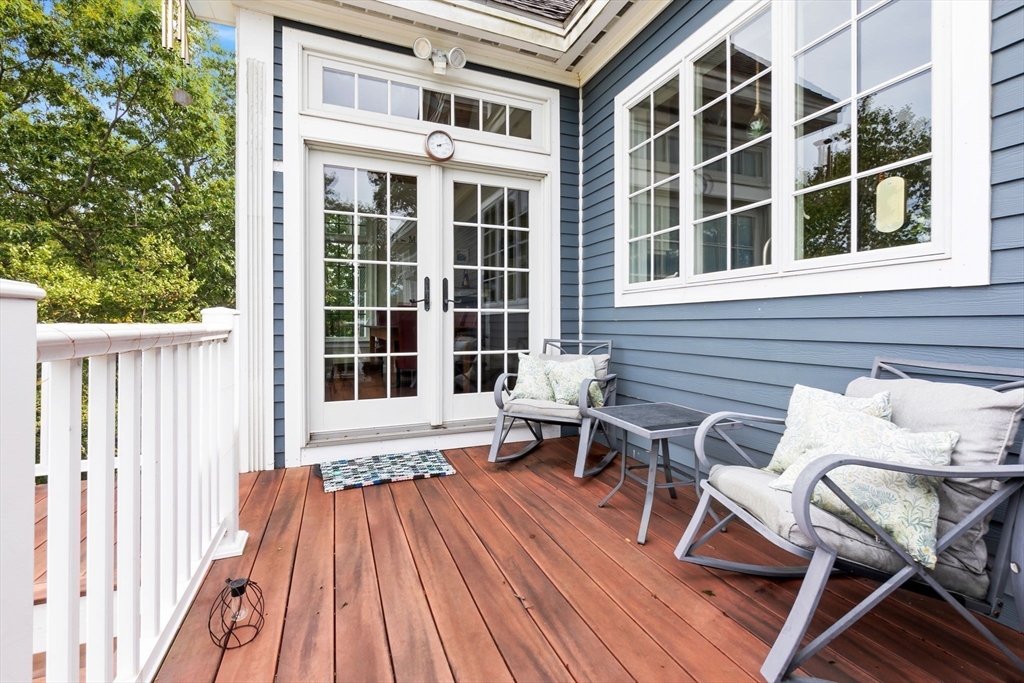 24 Old Rowley Road Newbury, MA 01951 - Photo 14 of 42 a balcony with table and chairs