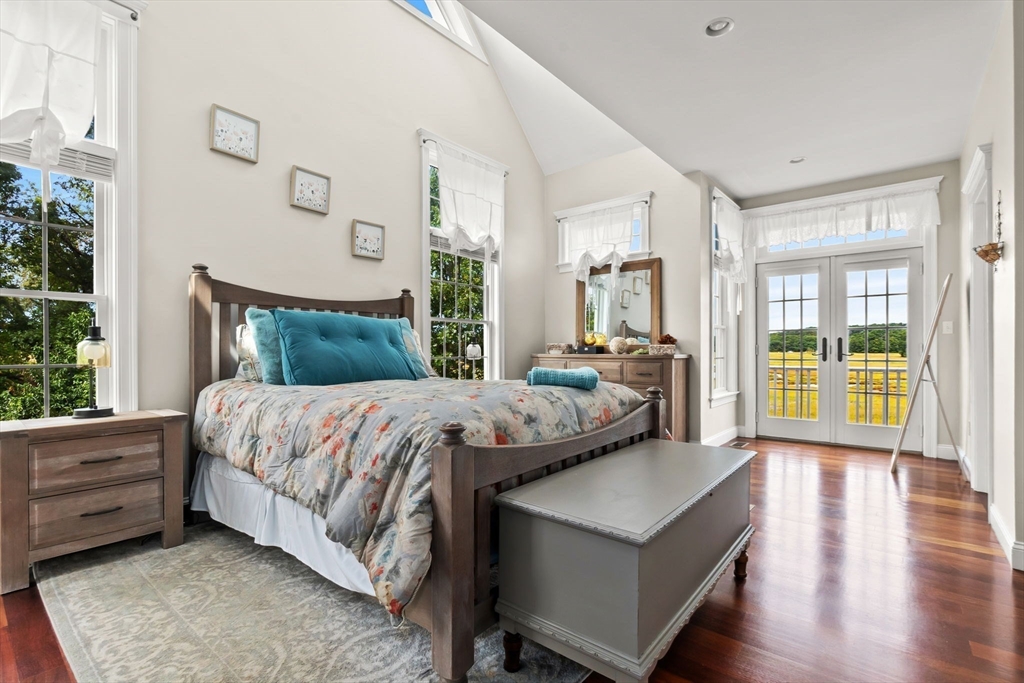 24 Old Rowley Road Newbury, MA 01951 - Photo 15 of 42 a bedroom with a bed and a large window