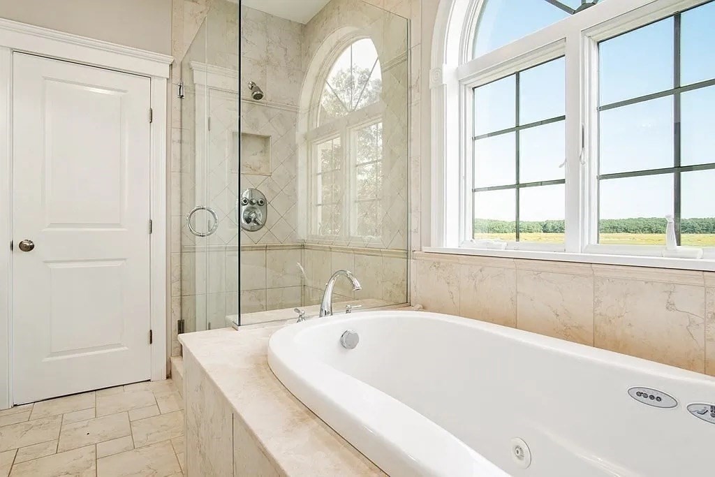 24 Old Rowley Road Newbury, MA 01951 - Photo 17 of 42 a white bath tub sitting next to a bathroom sink