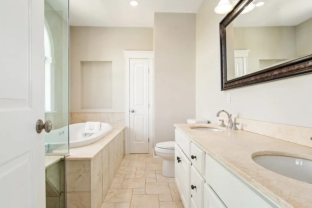 24 Old Rowley Road Newbury, MA 01951 - Photo 18 of 42 a spacious bathroom with a double vanity sink mirror and bathtub