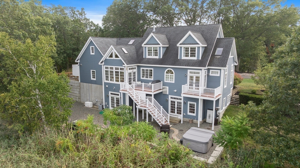 24 Old Rowley Road Newbury, MA 01951 - Photo 2 of 42 an aerial view of a house with a big yard and large trees