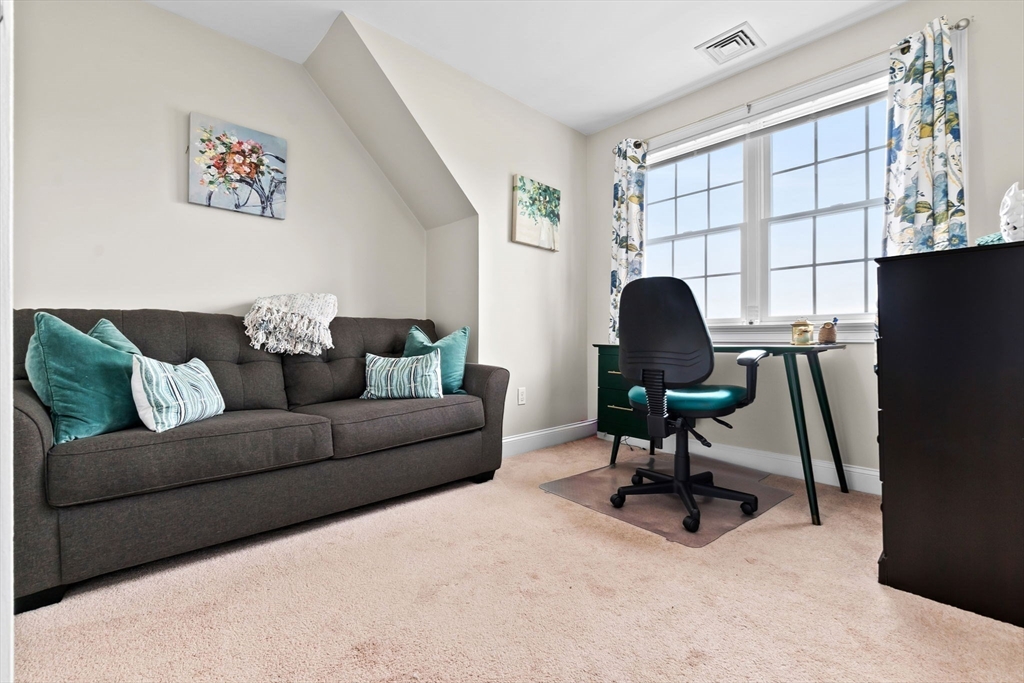 24 Old Rowley Road Newbury, MA 01951 - Photo 27 of 42 a living room with furniture a window and a potted plant