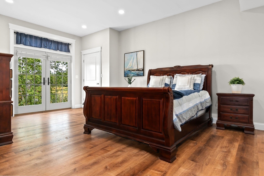 24 Old Rowley Road Newbury, MA 01951 - Photo 35 of 42 a bedroom with a bed and large windows