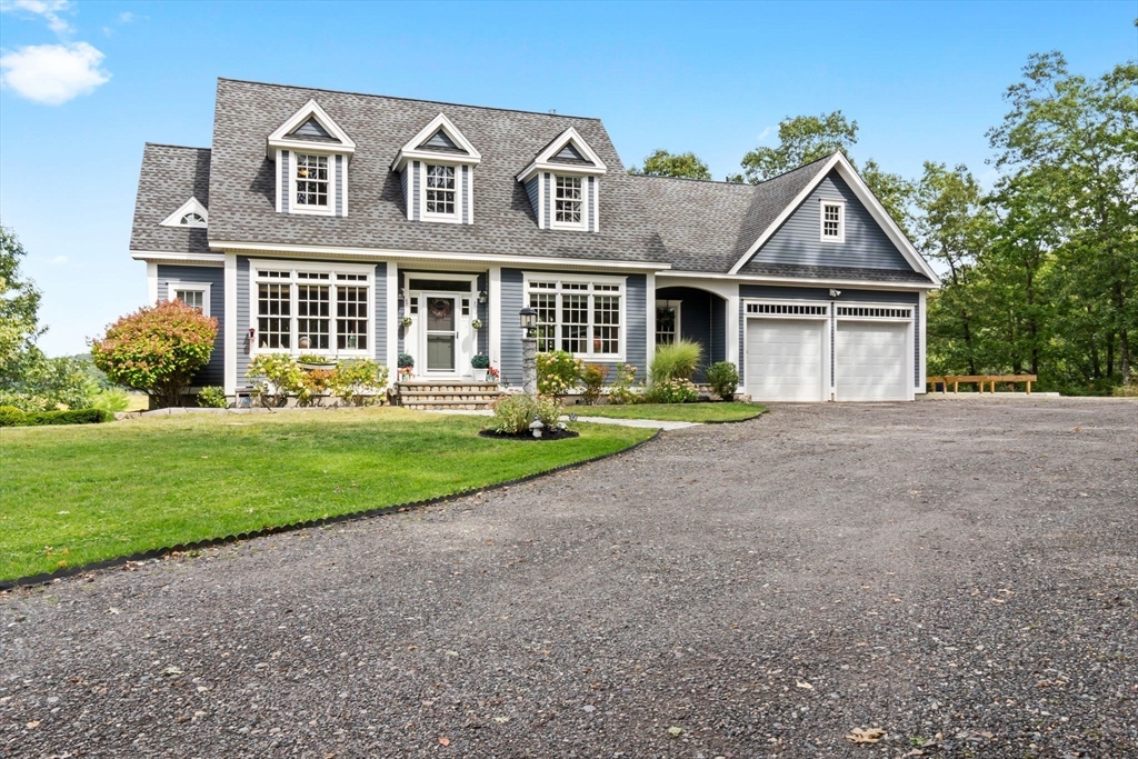 24 Old Rowley Road Newbury, MA 01951 - Photo 42 of 42 front view of a house with a yard