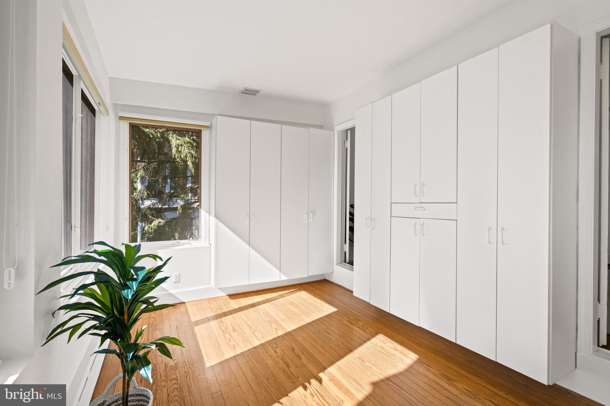 3214 Newark Street Northwest Washington, DC 20008 - Photo 18 of 38 a view of a room with a window and wooden floor