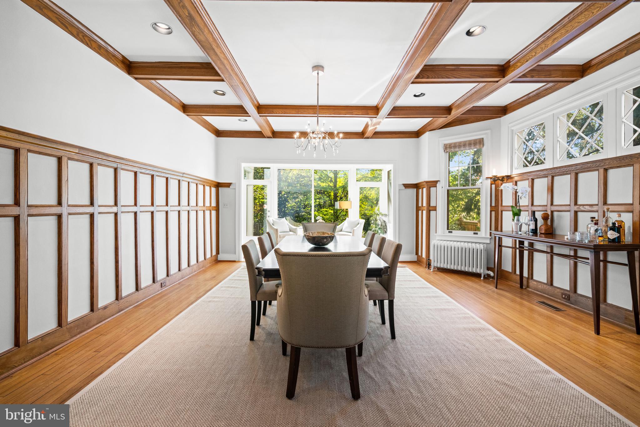 3214 Newark Street Northwest Washington, DC 20008 - Photo 6 of 38 a dining room with furniture a chandelier and wooden floor