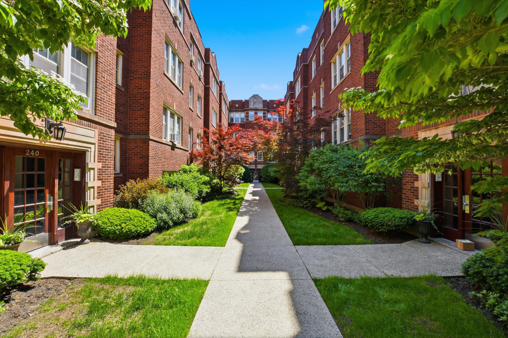 a view of a pathway both side of the house