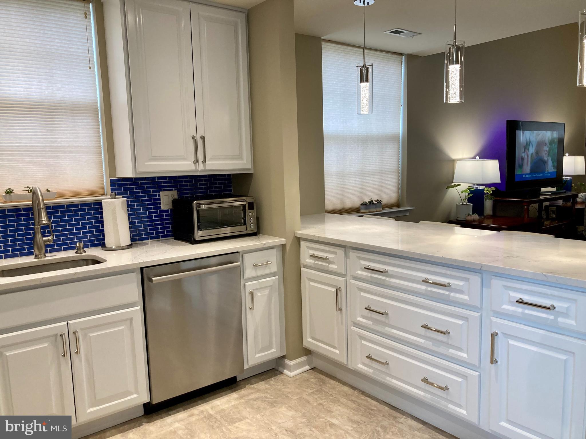 306 Ohio Avenue Wilmington, DE 19805 - Photo 3 of 13 a kitchen with cabinets appliances and a sink