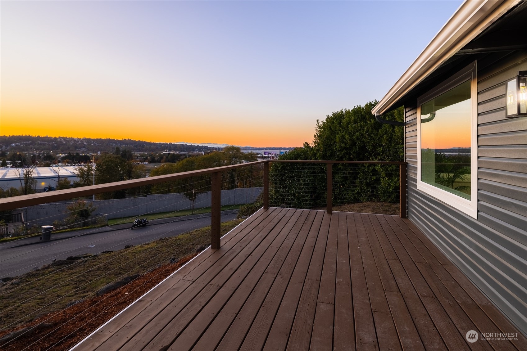 408 Grandey Way Northeast Renton, WA 98056 - Photo 3 of 34 a view of a balcony with wooden floor and fence