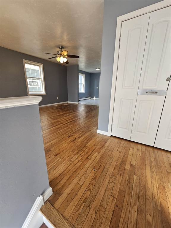 40 Merrick Street, Unit A Worcester, MA 01609 - Photo 15 of 32 a view of a room with wooden floor and staircase