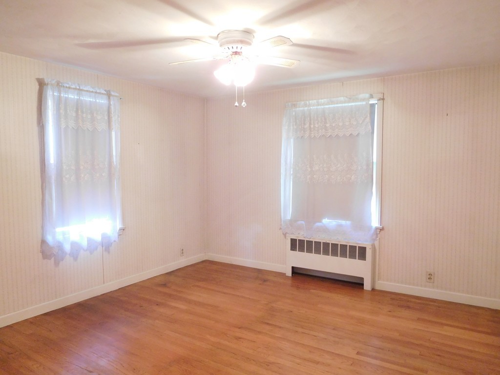 30 Elizabeth Street Springfield, MA 01109 - Photo 13 of 19 a view of an empty room with wooden floor and a window