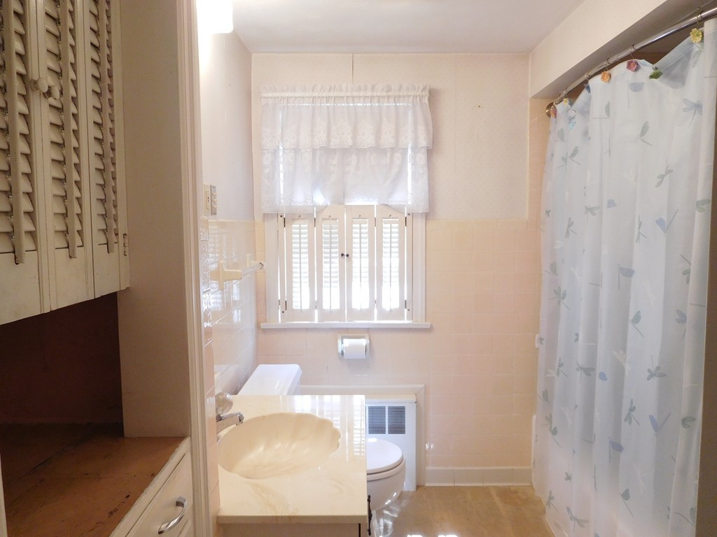 30 Elizabeth Street Springfield, MA 01109 - Photo 14 of 19 a view of a bedroom with wooden floor and furniture