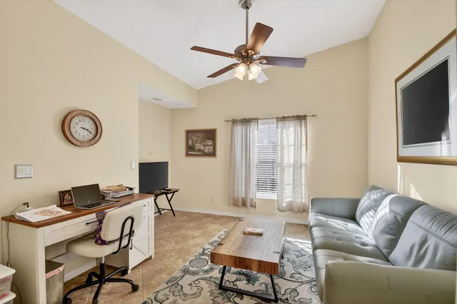 a bathroom with a sink vanity mirror and toilet