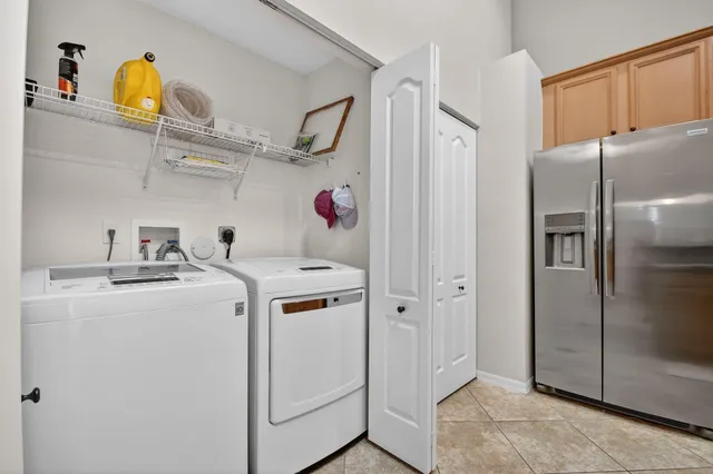 a living room with furniture large window and wooden floor
