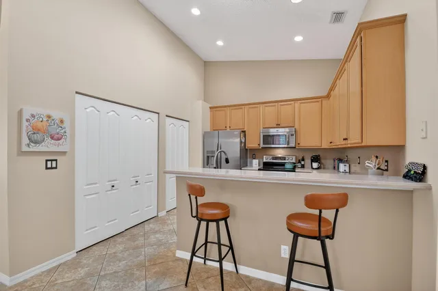 a kitchen that has a sink and a stove in it