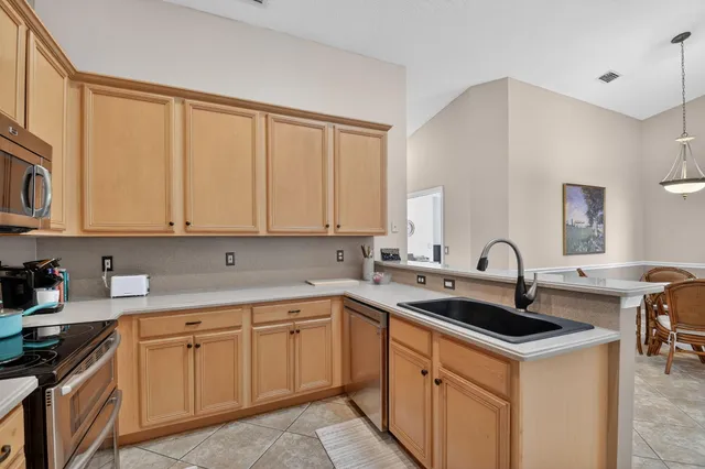 a dining room with furniture window and outside view