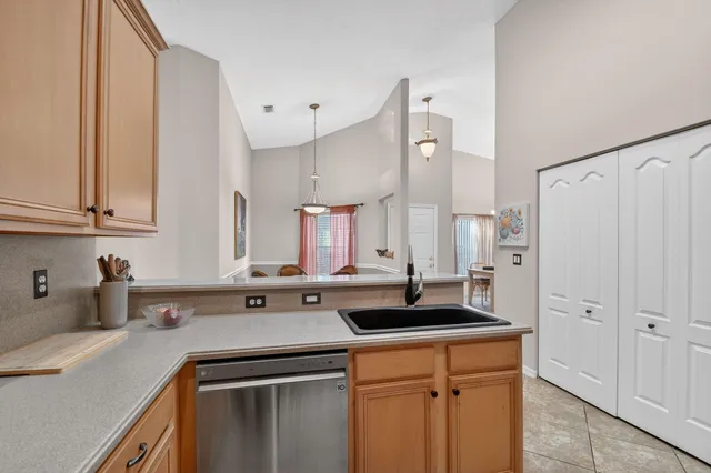a view of a dining room with furniture and window