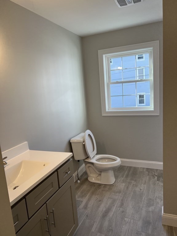 44 Downing Street Fall River, MA 02723 - Photo 6 of 10 a white toilet sitting next to a bathroom sink