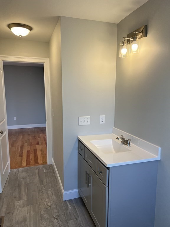 44 Downing Street Fall River, MA 02723 - Photo 7 of 10 a bathroom with a sink and a mirror