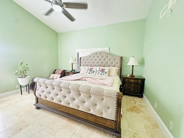 a bedroom with a bed and a table