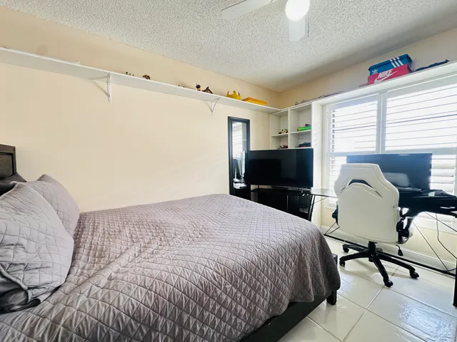 a bedroom with a bed and a table