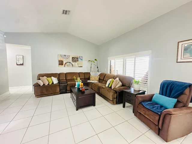 a living room with furniture and a couch