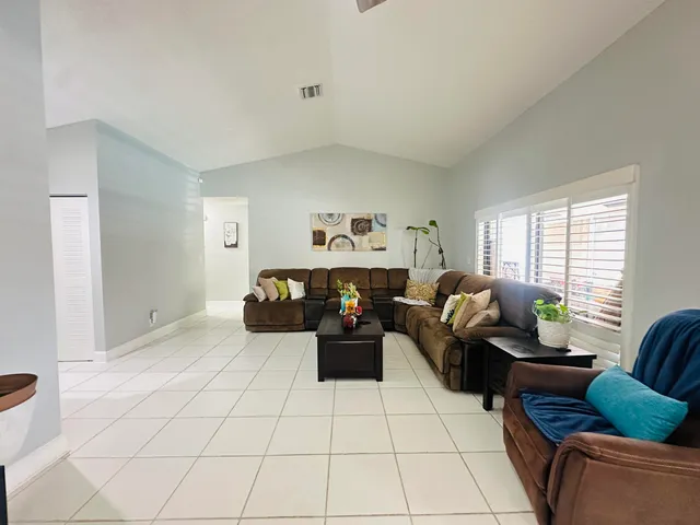 a living room with furniture and a couch
