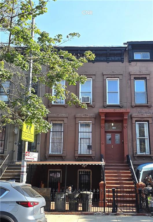 a front view of a building with balcony