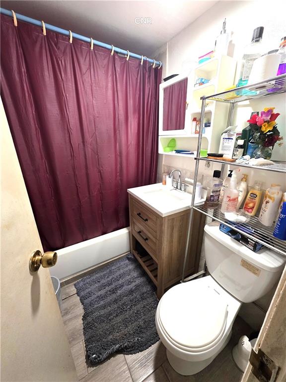 408 Madison Street Brooklyn, NY 11221 - Photo 11 of 17 a bathroom with a sink mirror vanity and toilet