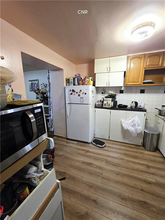 408 Madison Street Brooklyn, NY 11221 - Photo 14 of 17 a kitchen with a stove and a microwave