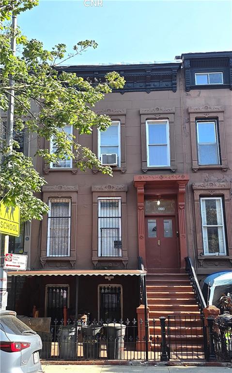 408 Madison Street Brooklyn, NY 11221 - Photo 2 of 17 a view of a building with glass windows and a tree