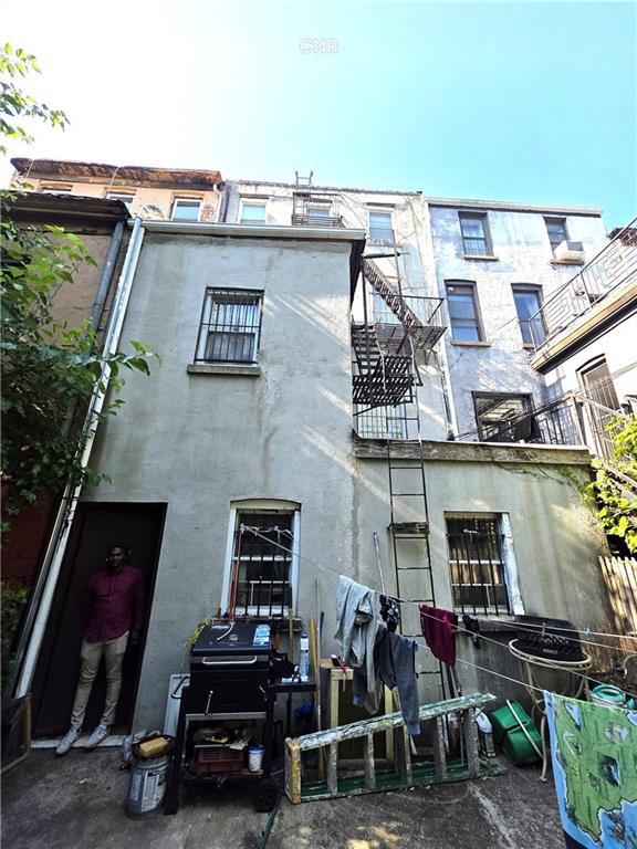 408 Madison Street Brooklyn, NY 11221 - Photo 3 of 17 an aerial view of a house with parking space
