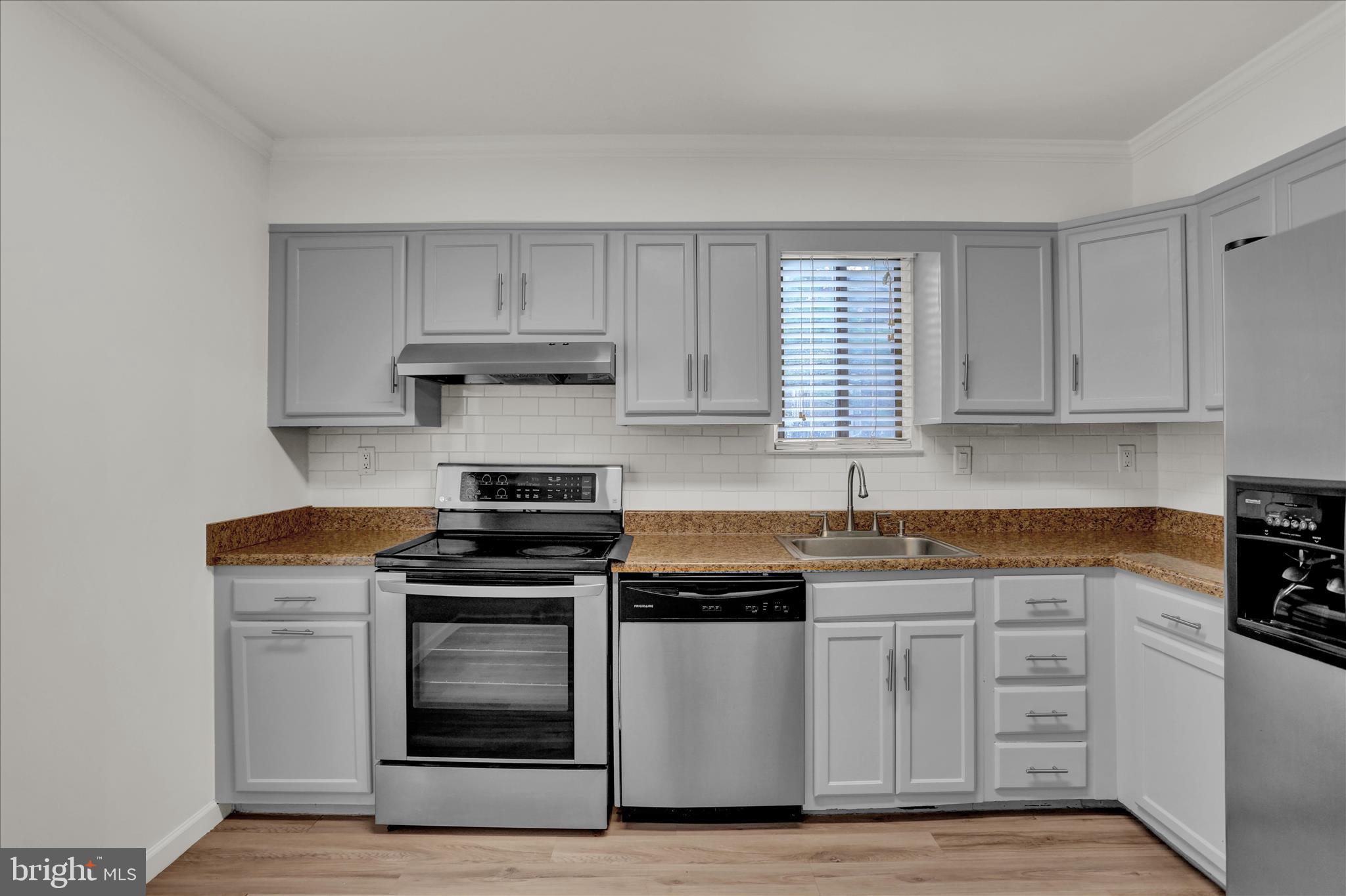 3 Willow Way Reading, PA 19606 - Photo 12 of 32 a kitchen with granite countertop a stove and a sink