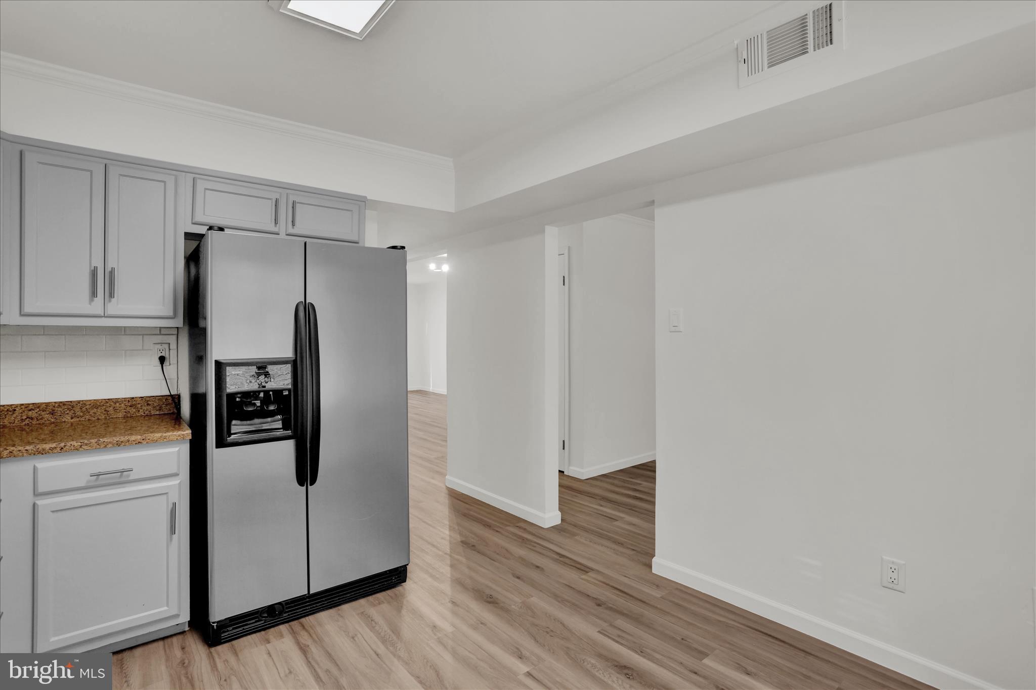 3 Willow Way Reading, PA 19606 - Photo 14 of 32 a kitchen with stainless steel appliances a refrigerator and wooden floor