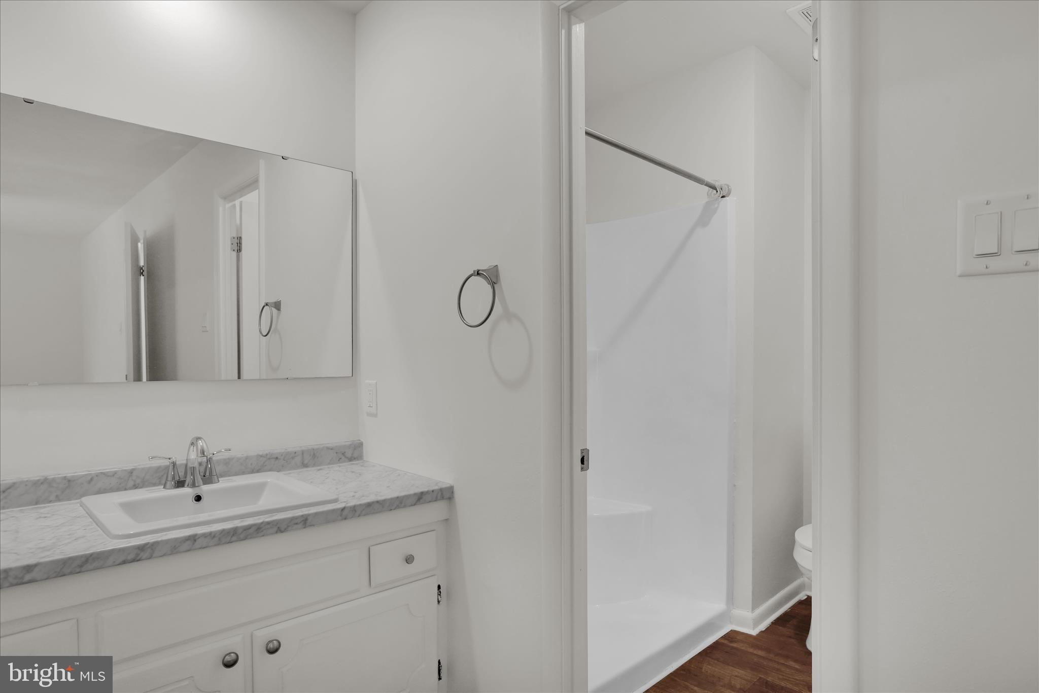 3 Willow Way Reading, PA 19606 - Photo 20 of 32 a bathroom with a granite countertop sink and a mirror