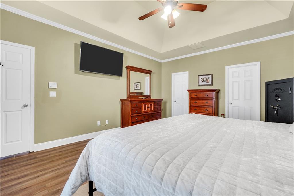 340 Roland Manor Drive Dacula, GA 30019 - Photo 14 of 50 a bedroom with a bed and a flat screen tv