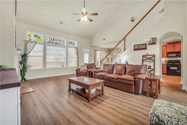 a living room with furniture and a large window