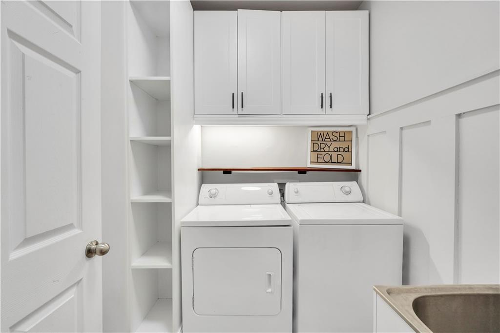 340 Roland Manor Drive Dacula, GA 30019 - Photo 31 of 50 a utility room with dryer and washer