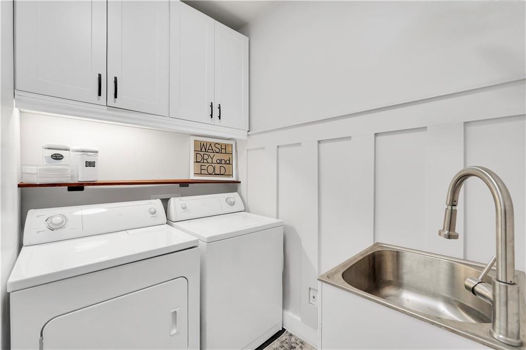 340 Roland Manor Drive Dacula, GA 30019 - Photo 32 of 50 a utility room with dryer and washer