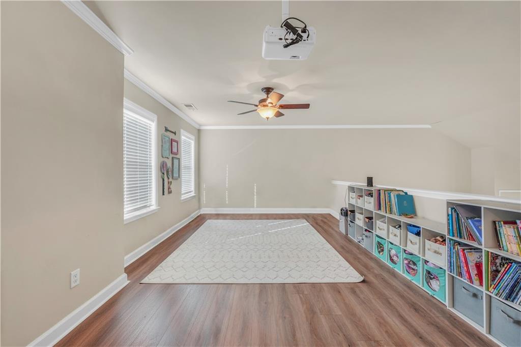 340 Roland Manor Drive Dacula, GA 30019 - Photo 33 of 50 an empty room with shelves