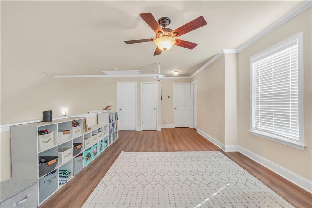 340 Roland Manor Drive Dacula, GA 30019 - Photo 34 of 50 wooden floor in an empty room with a window