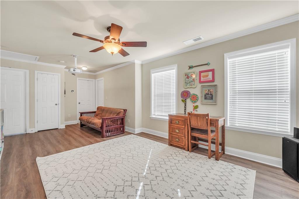340 Roland Manor Drive Dacula, GA 30019 - Photo 35 of 50 a bedroom with furniture and window