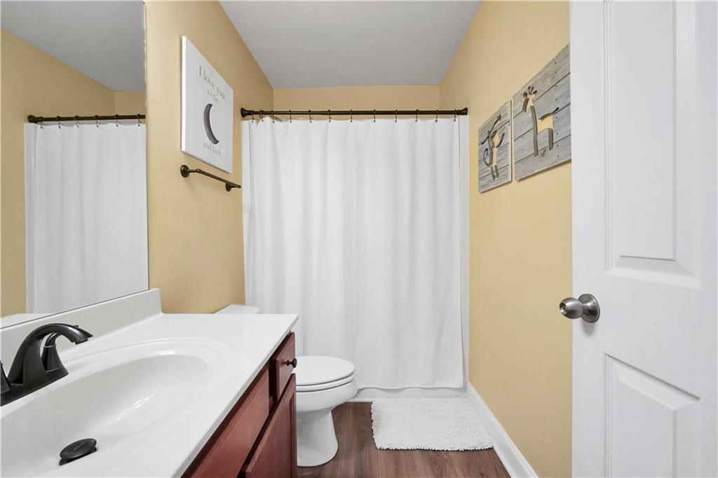 340 Roland Manor Drive Dacula, GA 30019 - Photo 39 of 50 a bathroom with a sink toilet and shower